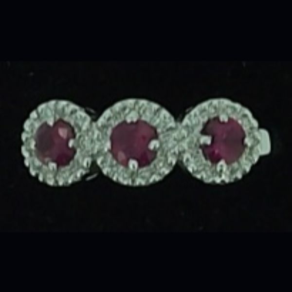 Sortija de oro blanco brillantes y rubies