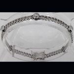 Pulsera en oro blanco con brillantes y eslabón barbado