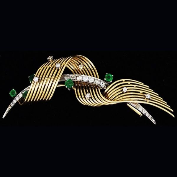 Broche en oro amarillo y blanco con brillantes y piedras preciosas