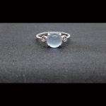 Anillo oro blanco con piedra central color celeste"Tous"