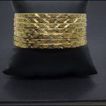 Semanario de 7 pulseras en oro amarillo con dibujos labrados en "x"