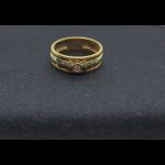 Anillo oro amarillo con brillante central de 0,05 qt y 6 puntas de brillantes