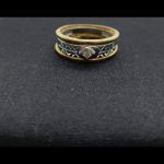 Anillo oro amarillo con faja central oro blanco con brillante de 0,02 qt