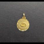 Medalla oro amarillo de 18k "simbolo alianzas entrelazadas"