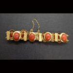 Pulsera oro amarillo 18k con piedras ovaladas de coral y cadena de seguridad(20 cm)