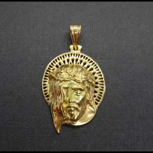 Colgante oro amarillo 18 kt del rostro de Cristo Crucificado