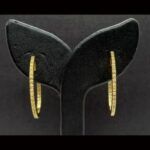 Argollas oro amarillo 18k rodeada de circonitas