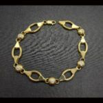 Pulsera oro amarillo 18k eslabones ovalados y circonitas 19 cm