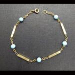 Pulsera oro amarillo 18k para niña con bolas celeste, 16 cm
