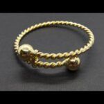 Pulsera torneada oro amarillo 18k con bolas en oro
