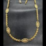Gargantilla oro amarillo 18k de 50 cm con forma cordón con eslabones intercalados con dibujos labrados