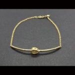 Pulsera oro amarillo 18k con motivo forma hoja con circonitas blancas (19 cm)