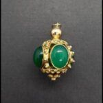 Colgante oro amarillo 18k con piedras verdes
