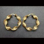 Argollas oro amarillo 18k con forma rizada