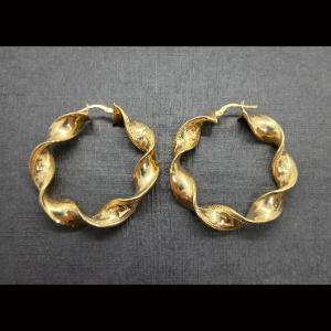 Argollas oro amarillo 18k con forma rizada