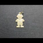 Colgante oro amarillo 18k forma niño