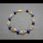 Pulsera oro amarillo 18k con bolas azules(18 cm)