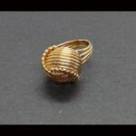 Anillo oro amarillo 18k con bola de aros entrelazados nº 13