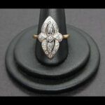 Anillo oro amarillo 18k nº 20 forma de pico con la parte central de oro blanco con circonitas