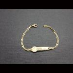 Pulsera oro amarillo 18k tipo esclava con imagen de un reloj en la placa 14cm