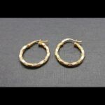 Argollas oro amarillo 18k formando dibujos rectangular