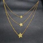 Gargantilla oro amarillo triple 18k de 44,5 cm con colgantes forma estrellas