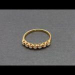 Anillo oro amarillo 18k nº 18,5 con 7 brillantes de 0,02 qt,total 0,14 qt