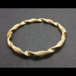 Pulsera oro amarillo 18k con forma rizada mate y brillo