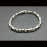Pulsera oro blanco de 18k con 15 brillantes de 0,08qtes cada uno, total 1,2qtes 18 cm