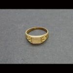 Sello oro amarillo 18k de bebe con dibujos en los laterales
