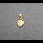 Colgante oro amarillo 18k con forma de corazón con circonitas