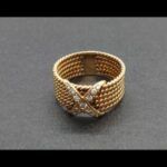 Anillo ancho oro amarillo 18 qt nº 18 con cruz central de puntas de brillantes