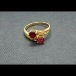 Anillo oro amarillo 18 qt nº 16 con circonitas blancas y 2 circonitas rosas en el centro