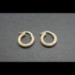 Argollas oro amarillo 18k con dibujos