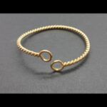 Pulsera oro amarillo 18 qt forma torneada