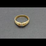 Anillo oro amarillo 18 qt nº 17 con brillante de 0,10 qt