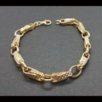 Pulsera oro amarillo 18k con eslabón entrelazado 21,5 cm