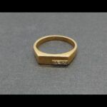 Anillo oro amarillo 18 qt nº 19 parte central plana con circonitas blancas