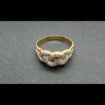 Anillo oro amarillo y blanco 18k con forma entrelazada decorada con puntas de brillantes nº 26