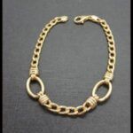 Pulsera oro amarillo 18k eslabón tipo barbada con dos aros ovalados 20 cm
