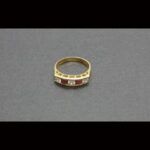 Anillo oro amarillo 18k con circonitas blancas y corintas nº 13