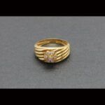 Anillo oro amarillo 18k tipo rayón con circonitas con forma de flor nº 15,5