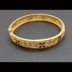 Pulsera oro amarillo 18 qt con detalles de filigrana y gemas coloridas engastada en diseño tradicional de la India
