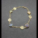 Pulsera oro amarillo 18k con eslabones redondos y circonitas de distintos colores 18,5 cm