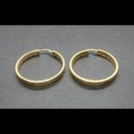 Argollas oro amarillo 18 k con dibujos labrados(3 cm de diámetro)