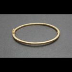 Pulsera oro amarillo 18k con forma ovalada lisa