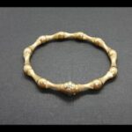 Pulsera oro amarillo 18k de 19 cm con eslabones con diseño bambú pulidos en brillo y satinado
