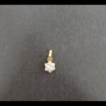 Colgante oro amarillo 18k con forma de flor con circonitas